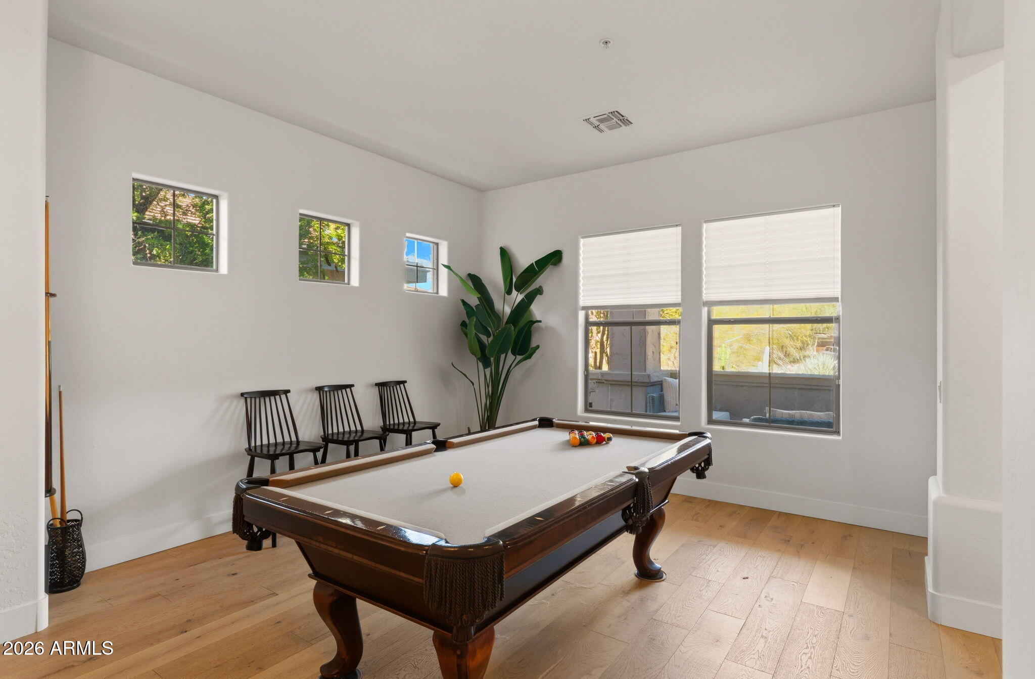 Bonus room set up as a game room with a pool table